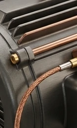 Close-up of industrial motor cooling fins and metal housing