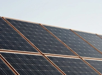 Solar panel array against an empty sky